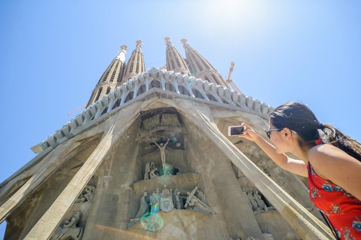 Tourist taking pictures at Sagrada Familia